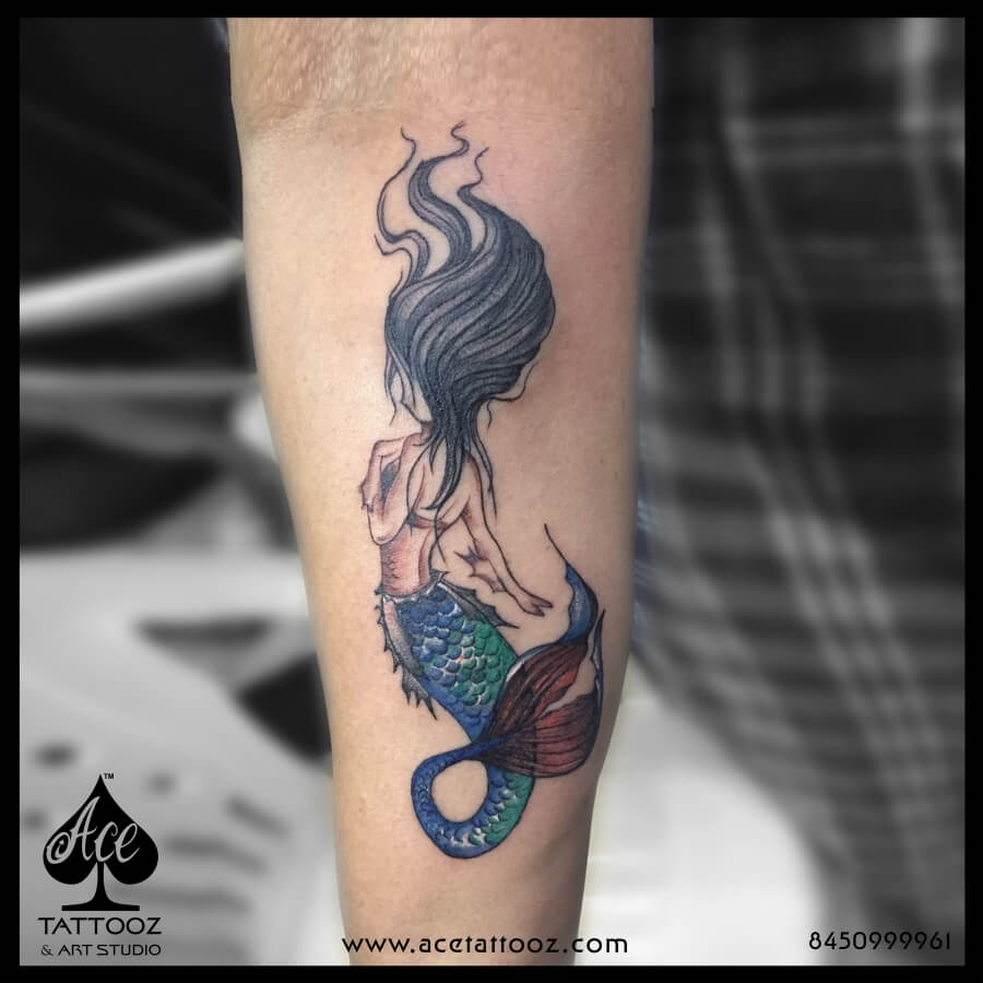 Single needle whale and mermaid tattoo on the inner
