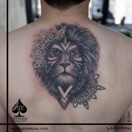 Black and White Lion Tattoo on Back - Ace Tattooz