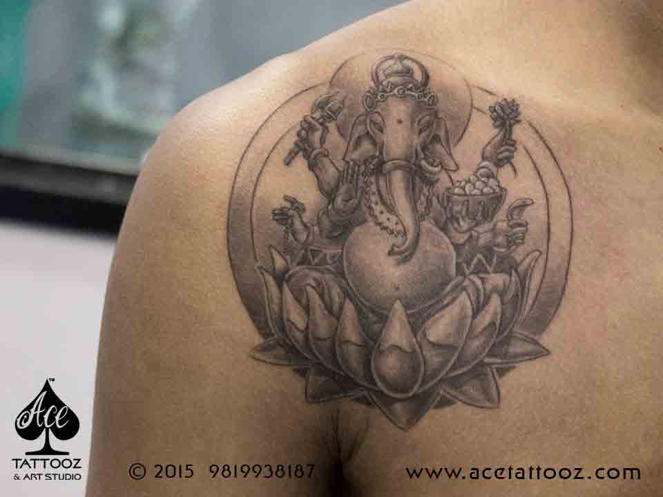 Ganesha with Lotus Tattoo on Shoulder
