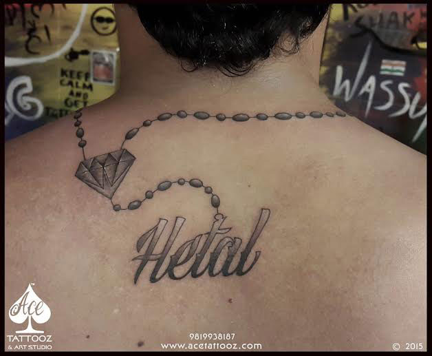 Hetal Name Tattoo on Back - Ace Tattooz