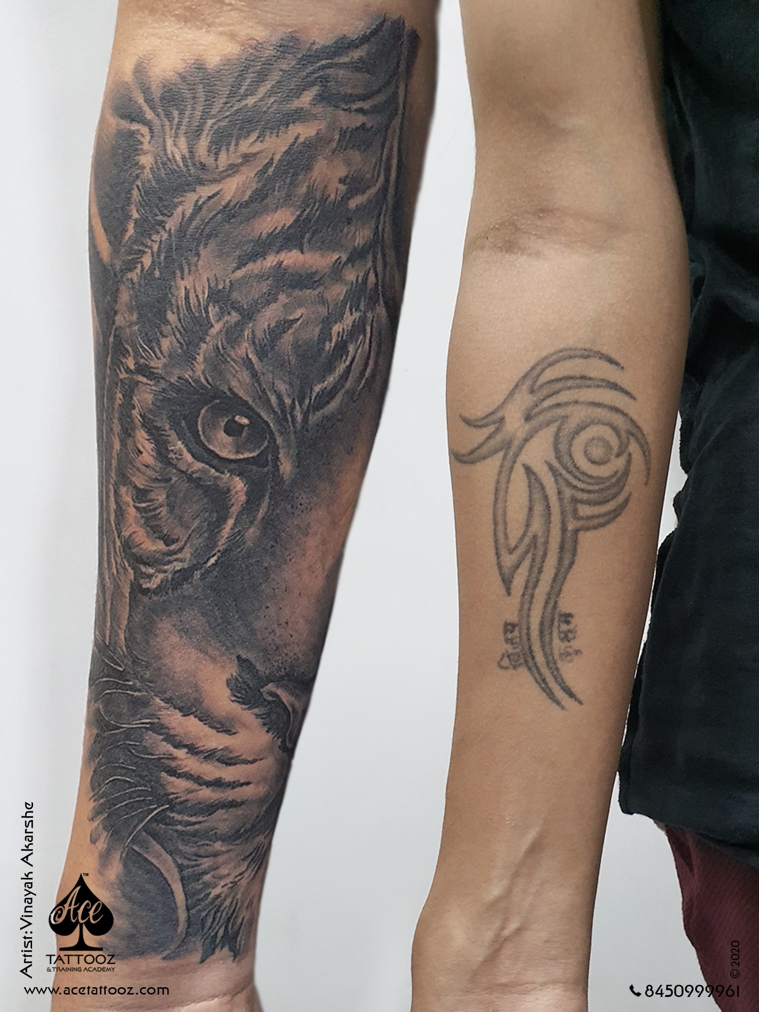 Realistic Tiger face Tattoo on the forearm in armband style divided in two  bands and the script ROAR written on the back of the band in… | Instagram