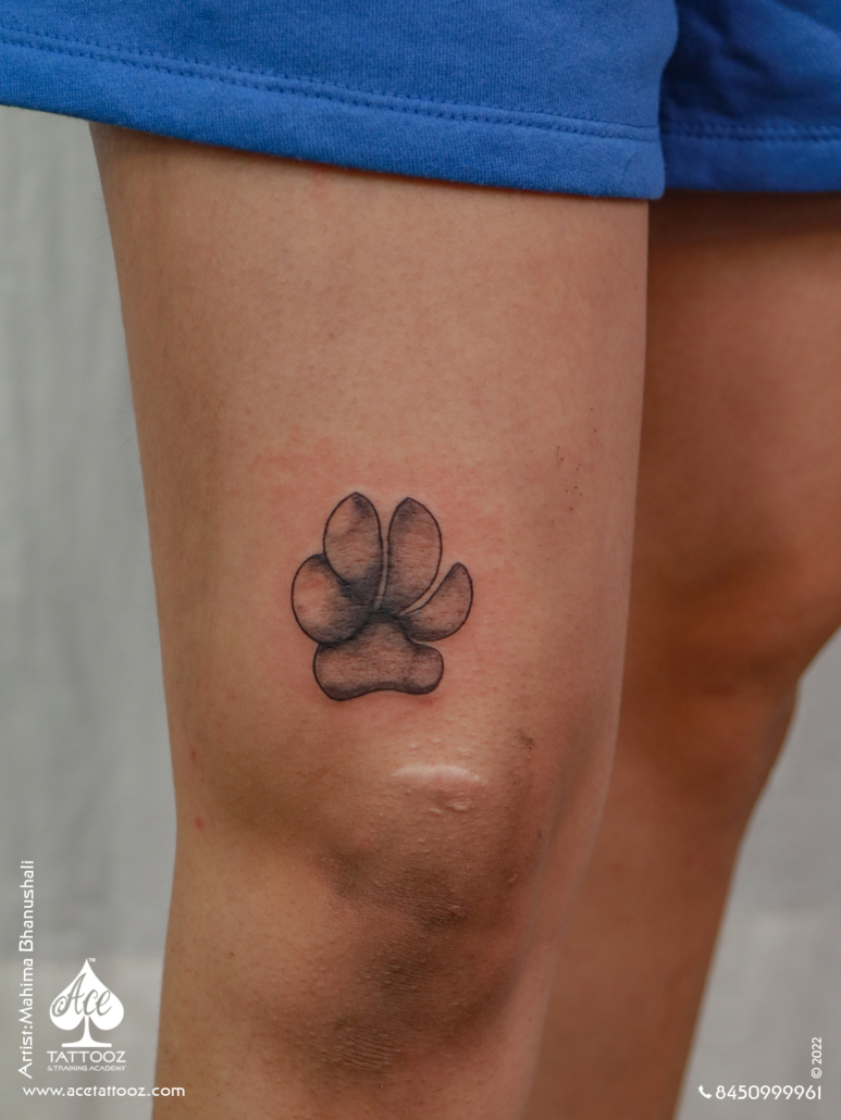 Black and white Dog Paw tattoo