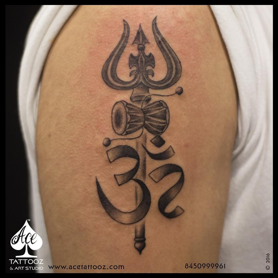 Om and Trishul tattoo on arm