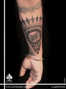 An exquisite Mandala tattoo with a Damru inscribed within the design. Mandala tattoo represents wholeness with perfection, balance, and eternity. This design symbolizes a deep spiritual belief which connects with the tattoo bearer.