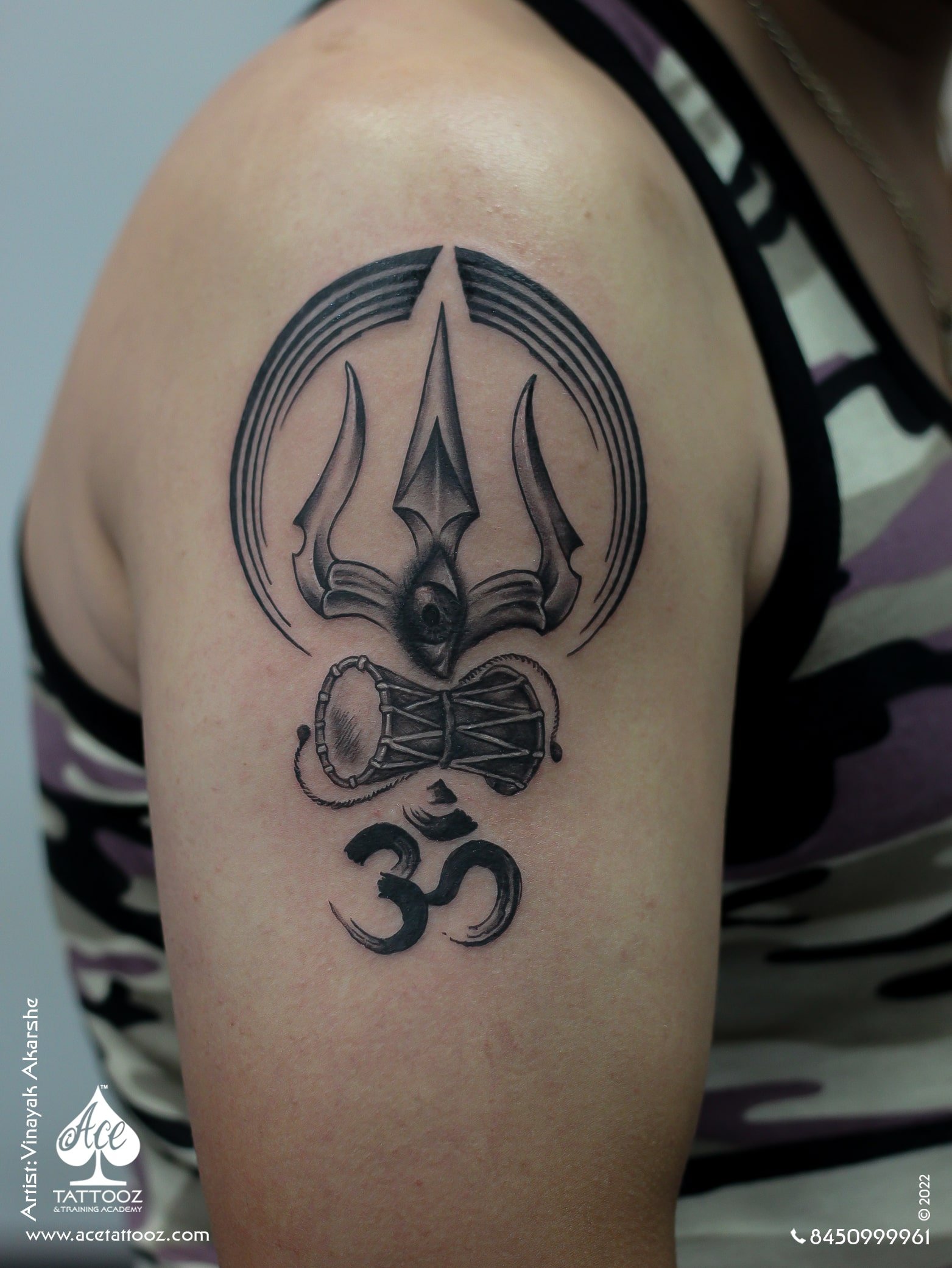 Trishul and OM tattoo