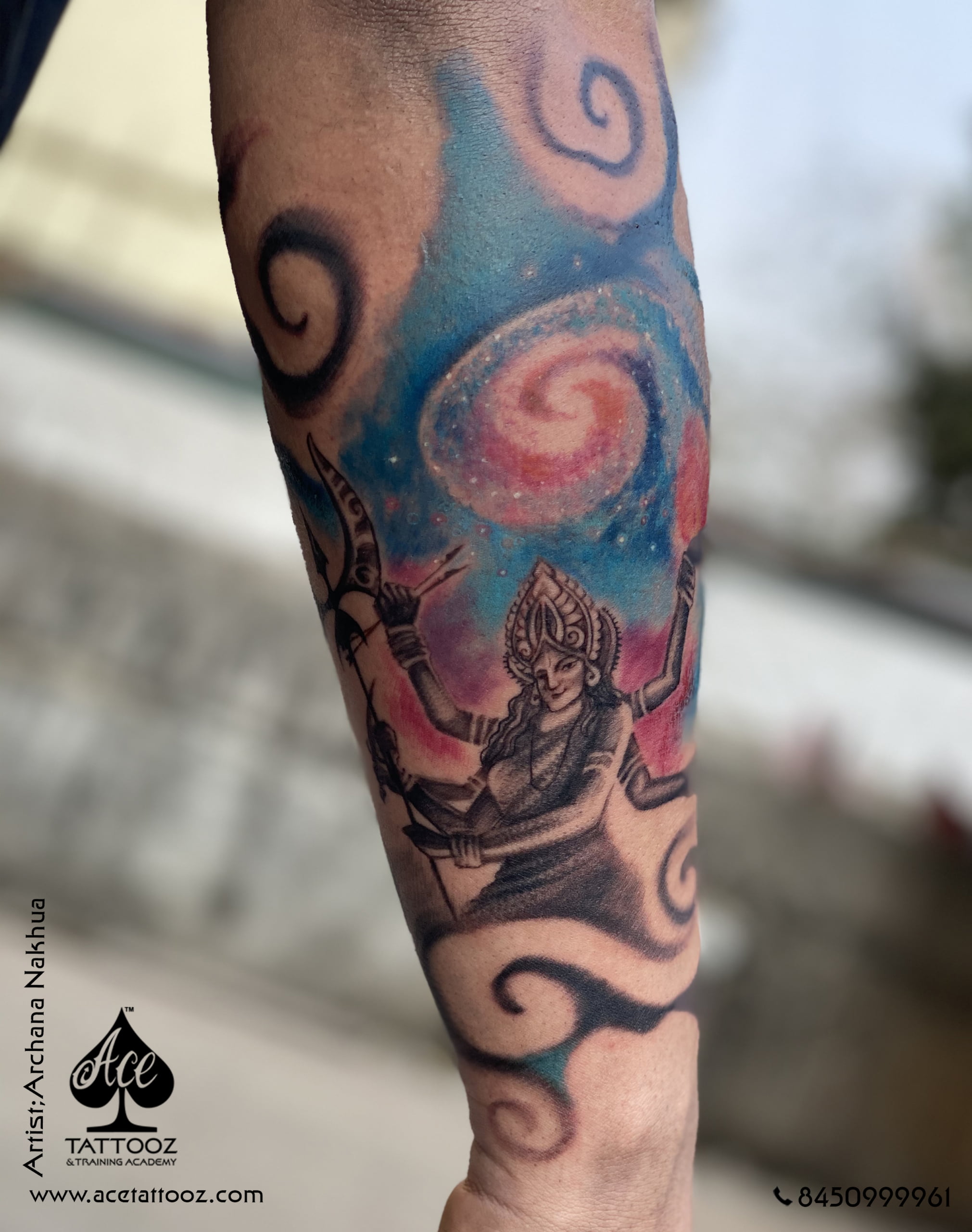 Radiant Goddess Parvati, adorned with celestial grace, etched in vibrant hues and crowned by a mesmerizing galaxy, embodies the universe's beauty and power in this breathtaking color tattoo.