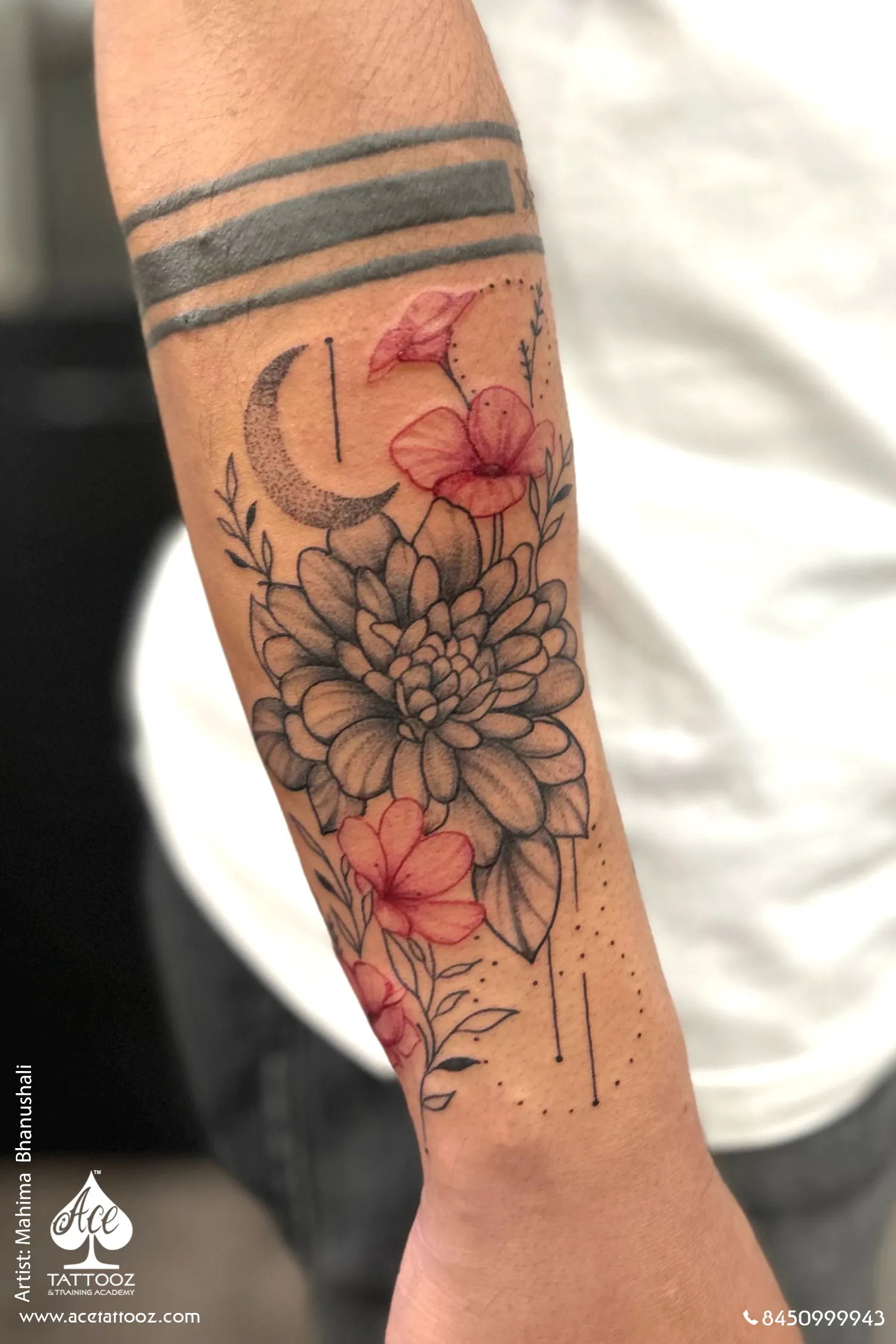dahlia and hibiscus forearm tattoo with crescent moon ace tattooz