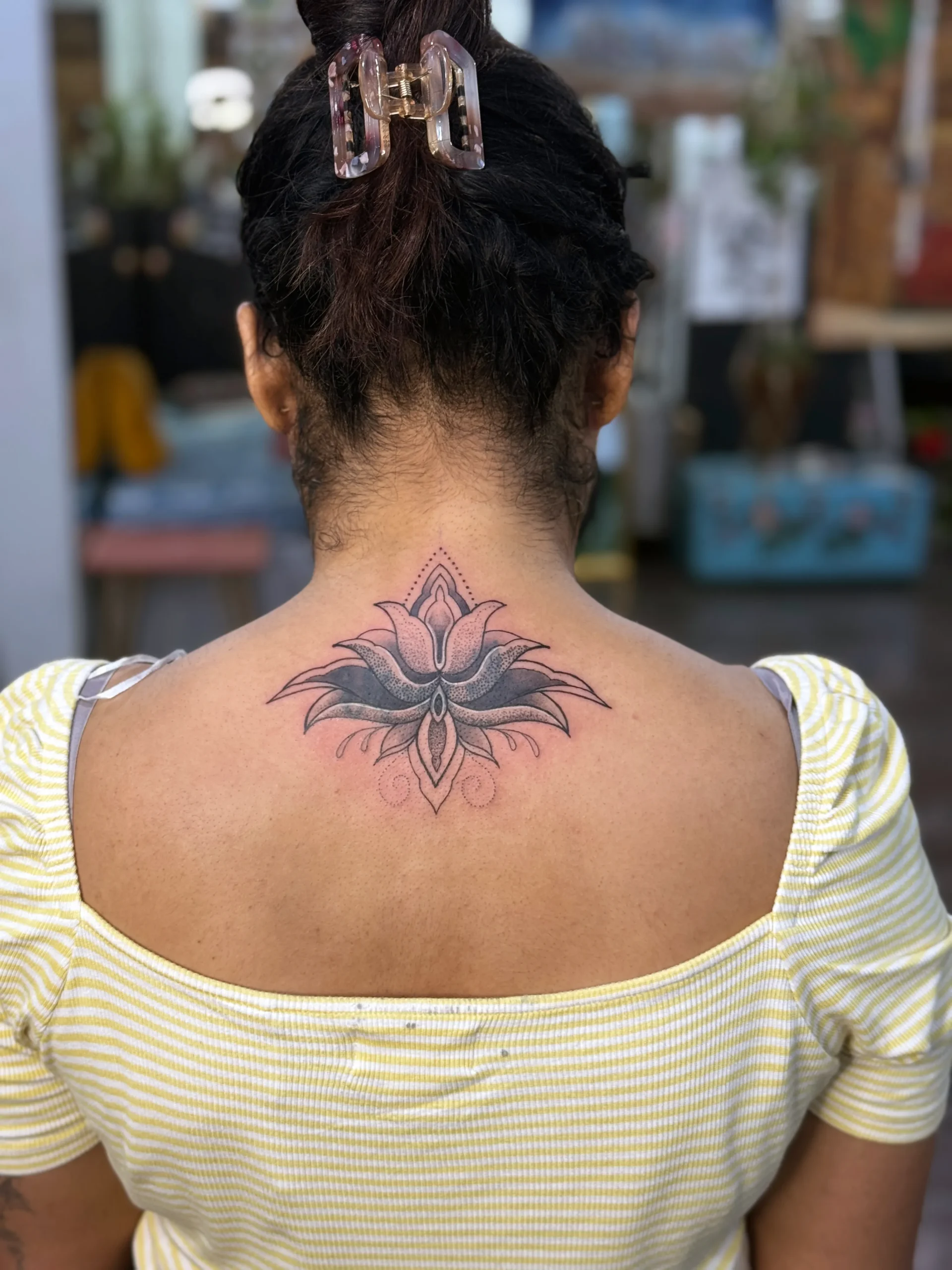lotus coverup tattoo – lotus neck upper back tattoo ace tattooz