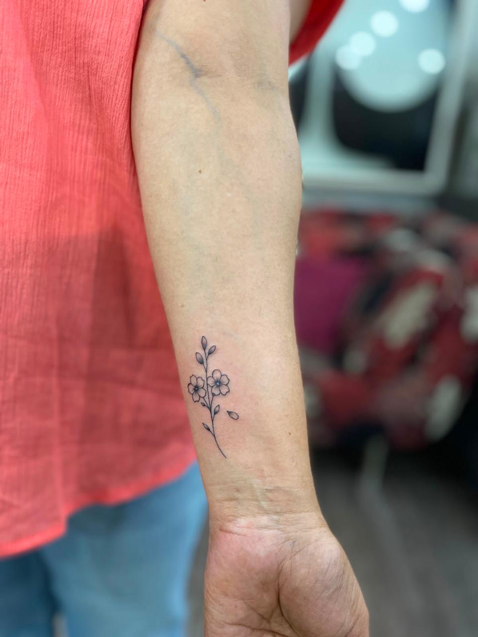 Dotwork modaka tattoo on an inner bicep