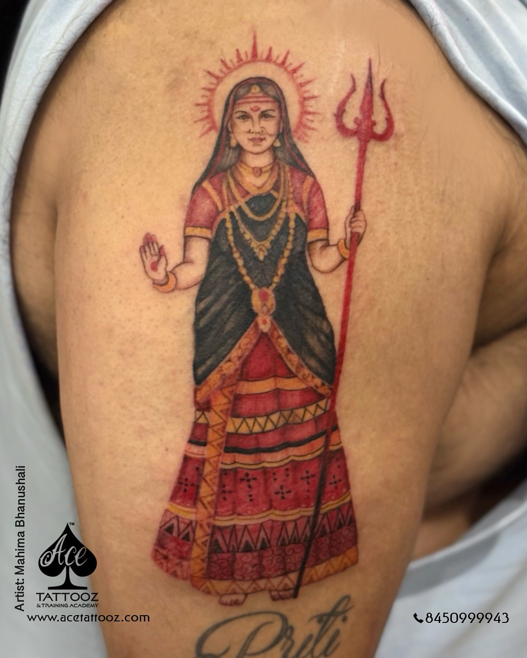 Dotwork modaka tattoo on an inner bicep