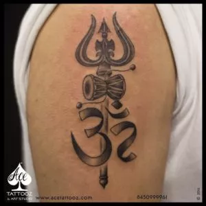 Om and Trishul tattoo on arm