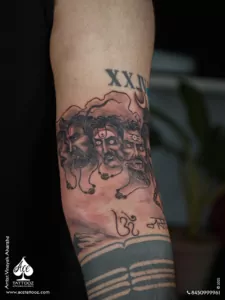 Shiva 10 Faces Tattoo on arm