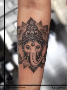 Lord Ganesha face tattoo